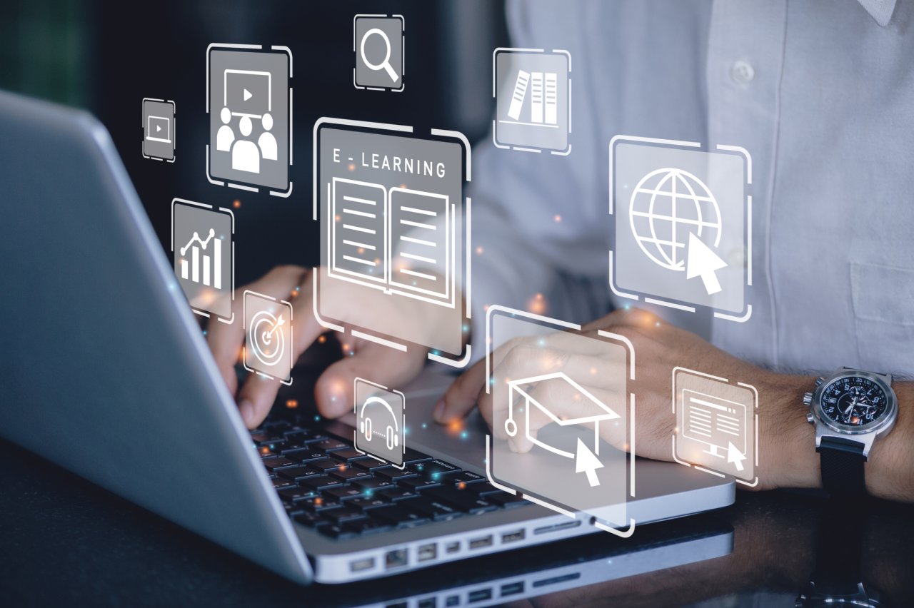 Digital image with icons and a person using a laptop