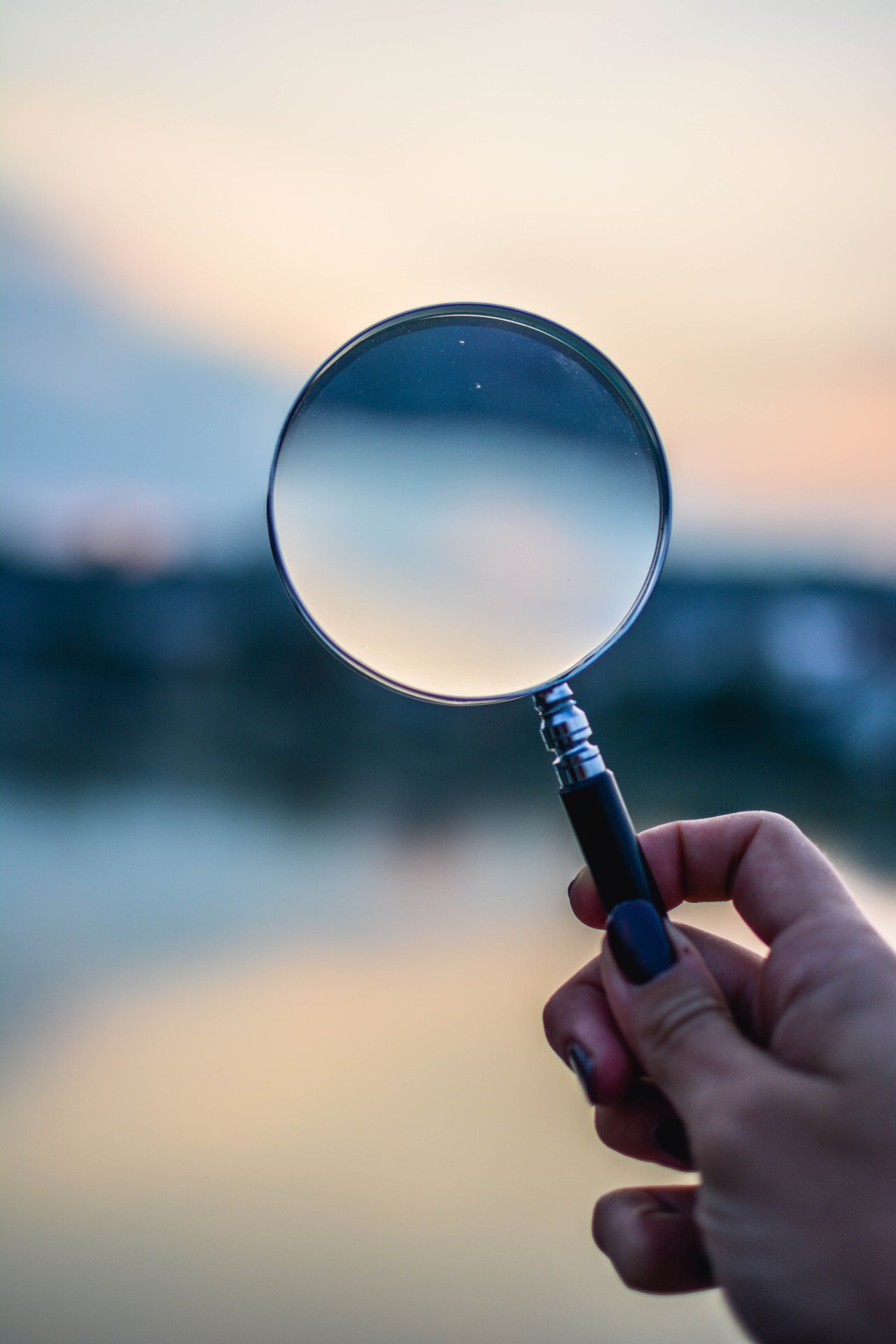 A magnifying glass - https://www.pexels.com/photo/selective-focus-photo-of-magnifying-glass-1194775/